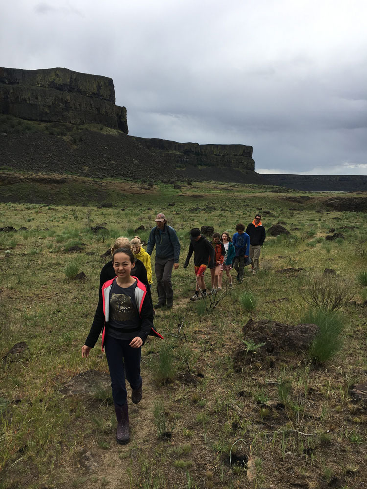 https://windsongschool.org/wp-content/uploads/2025/02/Grade6hiking-around-inside-the-coulee_40448070250_o-e1537218236208.jpg
